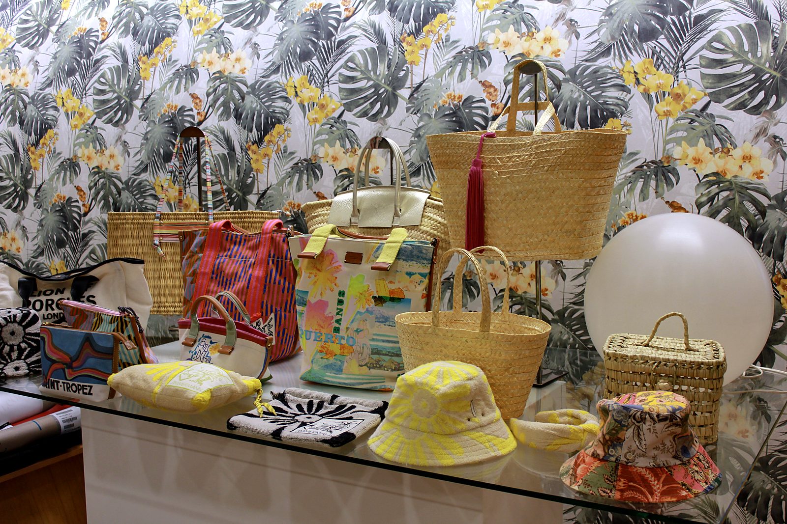 Bags, hats and accessories displayed in the showroom