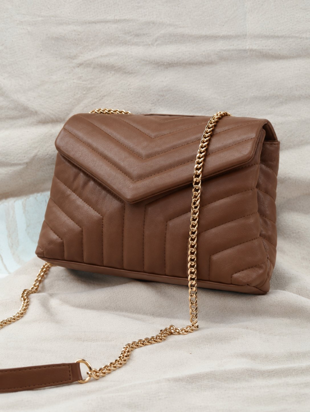 Brown quilted leather shoulder bag with gold chain strap