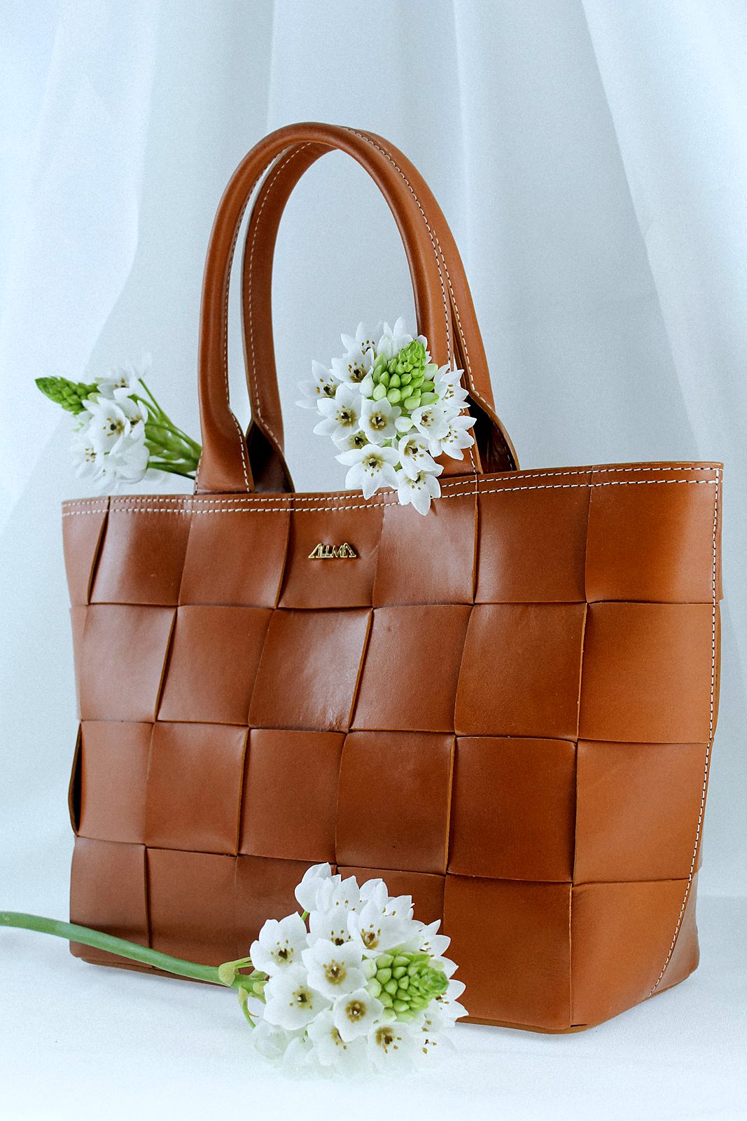 Woven tan leather tote