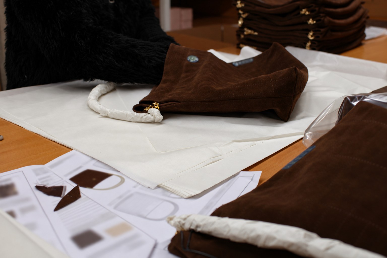 Suede bags wrapped in tissue paper and packed for shipment